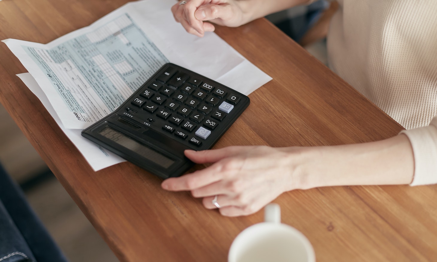 woman using calculator