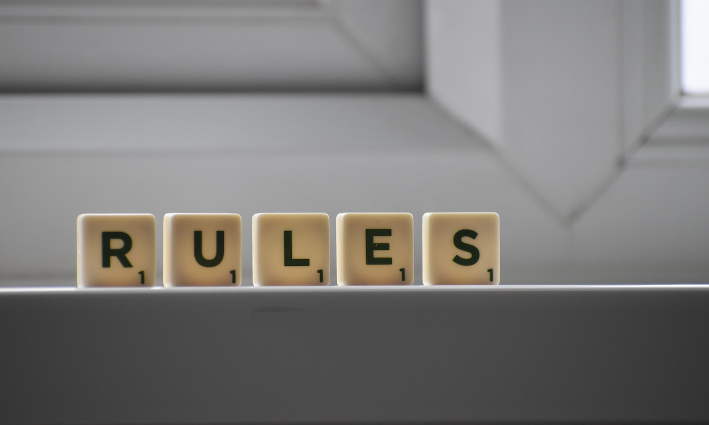 cubes with letters forming the word rules