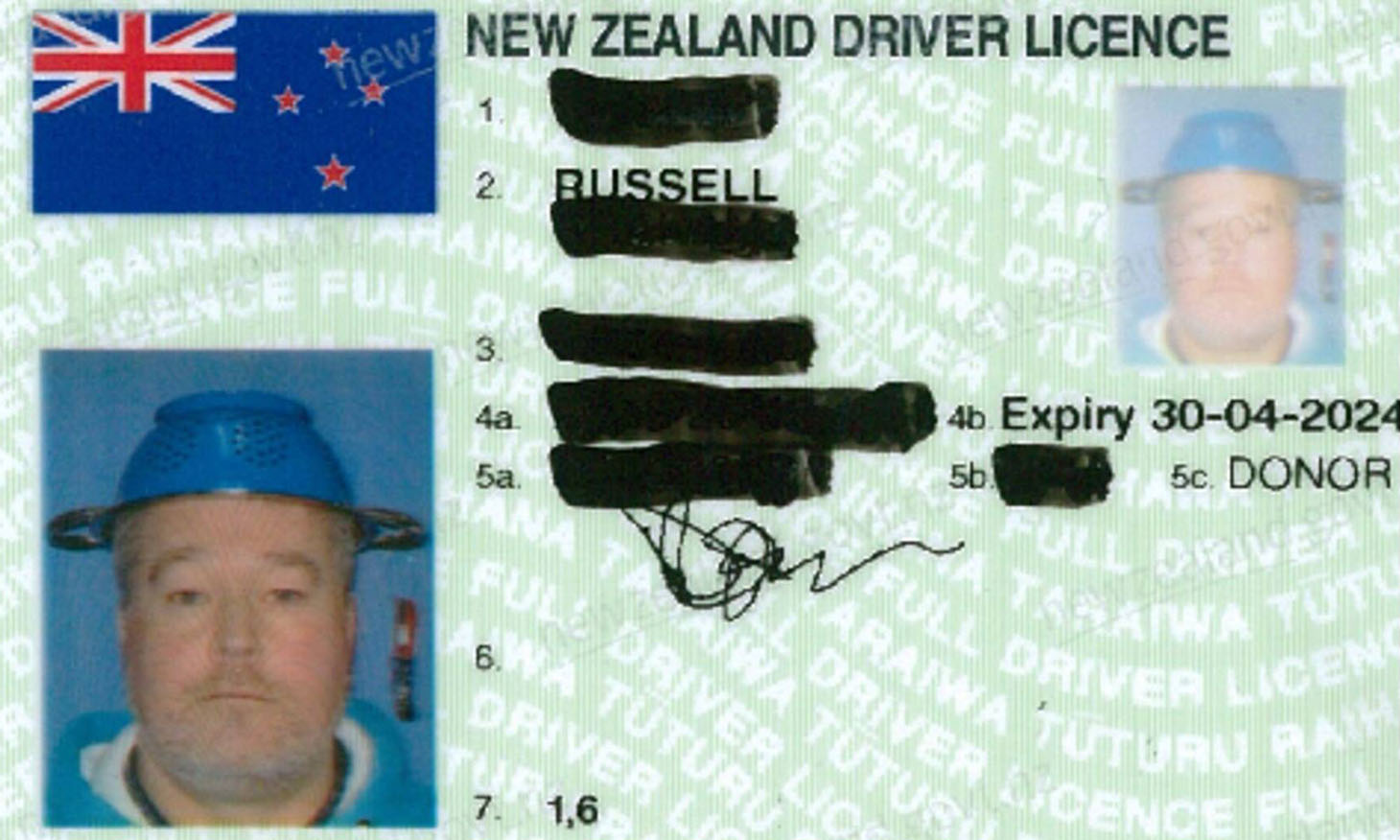 driver licence headshot with a man wearing colander in it