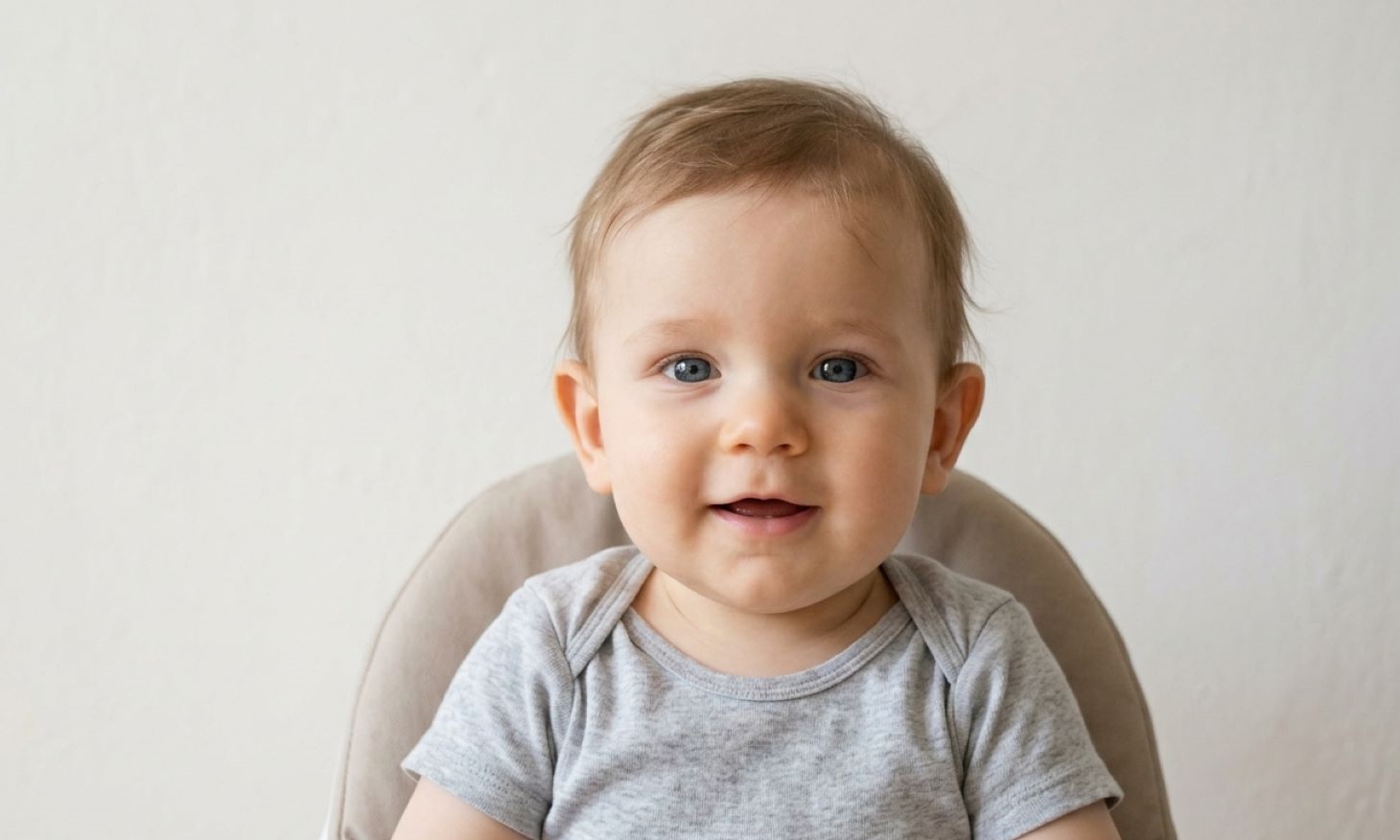 baby smiling in passport photo