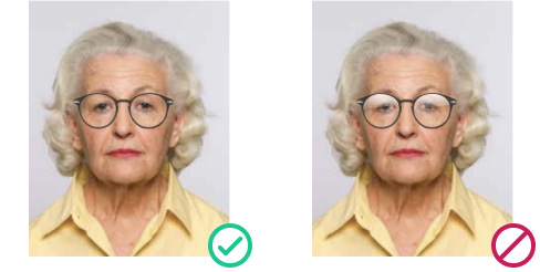 UK passport photo example: correct use of clear prescription glasses vs. rejected photo with glare on lenses 