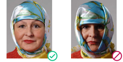 UK passport photo example: correct religious head covering with full face visible vs. invalid headwear obscuring facial features 